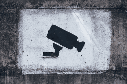 a painted security camera on a wall