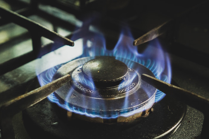Blue flame burns on a gas burner