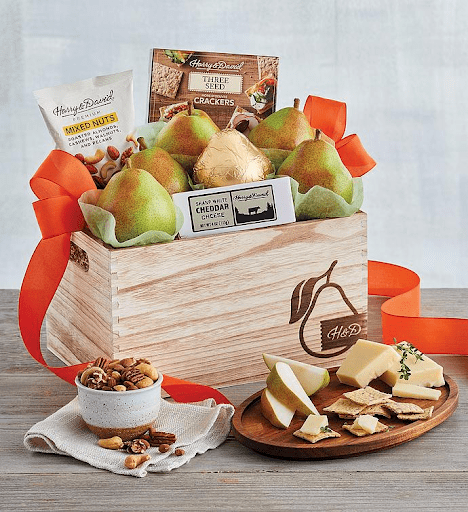 a gift basket filled with snacks and fruits