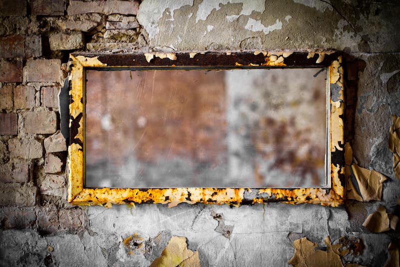 A rectangle mirror hanging on a wall