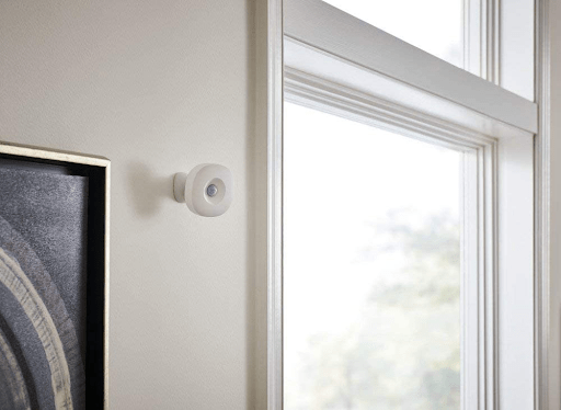 Samsung SmartThings Motion Sensor mounted by a window.