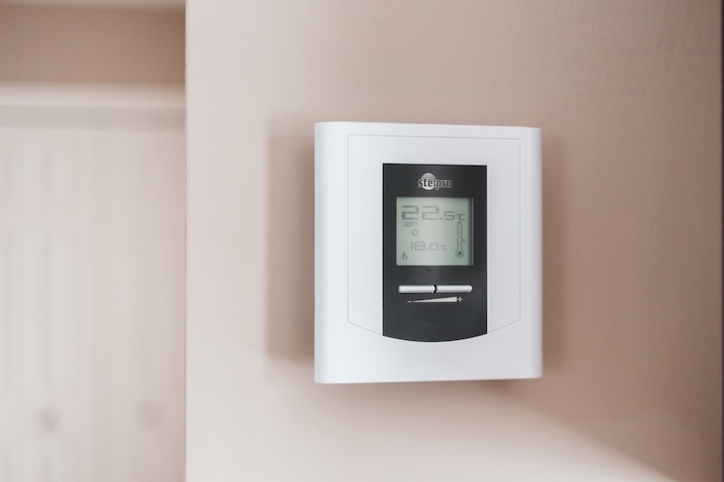 a Stelpro thermostat mounted on a white wall