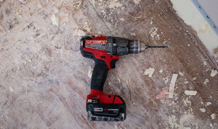 A typical power drill with a masonry drill bit attached