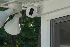 an Amazon Blink Security System installed under a roof