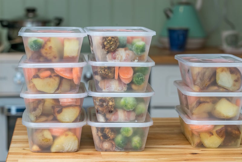 Pre-prepared meals packed into plastic containers.