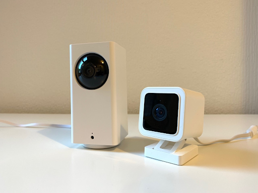 The Wyze Cam Pan v2 (left) and the Wyze Cam v3 (right) on a table