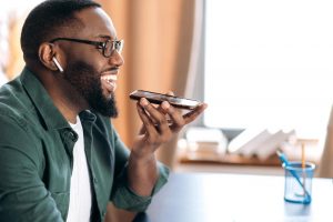 man holding a phone and speaking