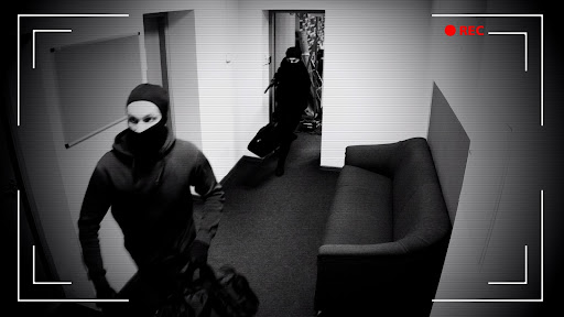Armed burglars caught fleeing a burglary via home security camera footage.