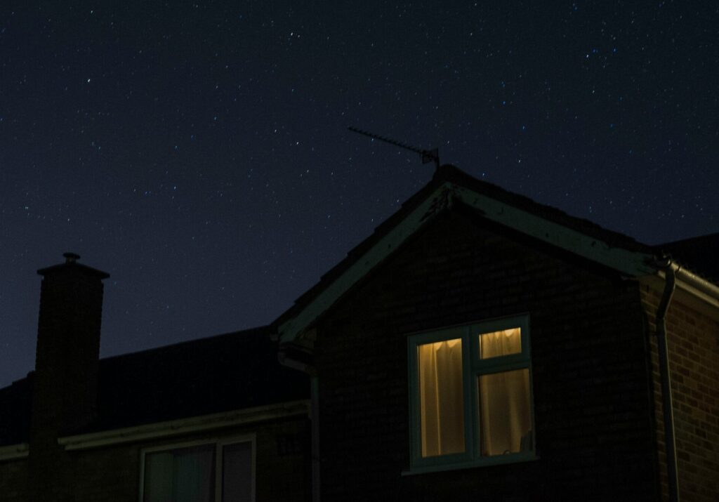 House with lights on at night